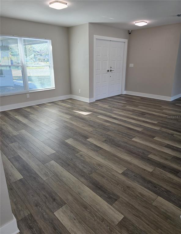 2940 Cypress Ridge Palm Harbor, FL 34684 - Photo 42 of 53 an empty room with wooden floor and windows