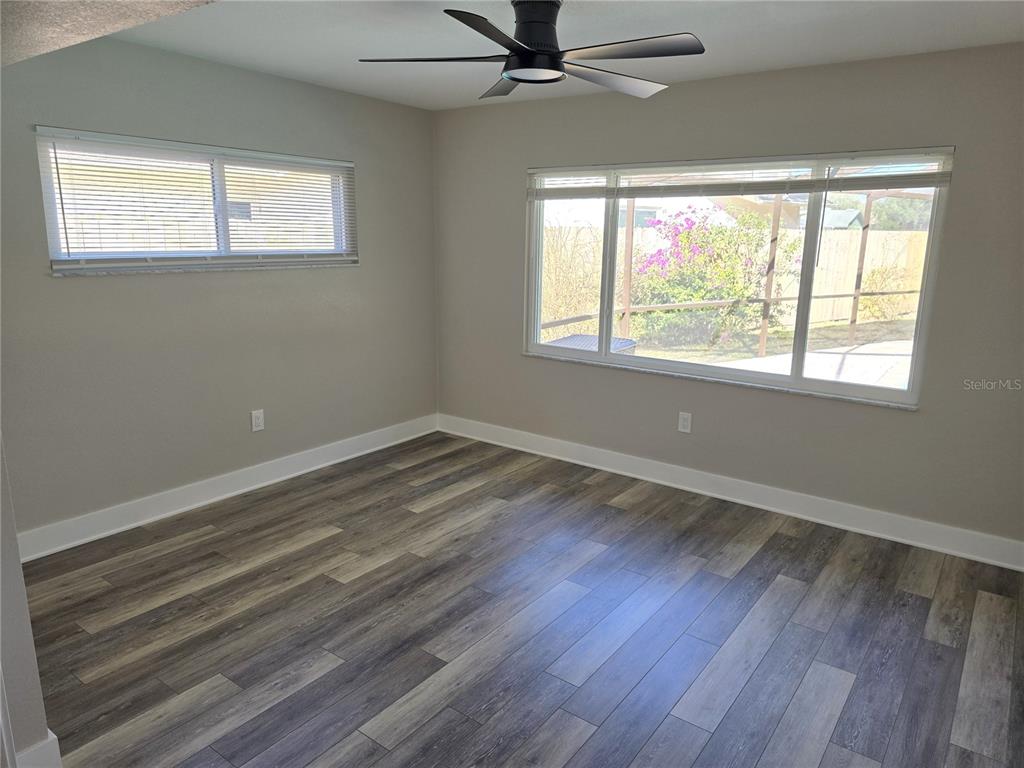 2940 Cypress Ridge Palm Harbor, FL 34684 - Photo 46 of 53 a view of a room with wooden floor and windows