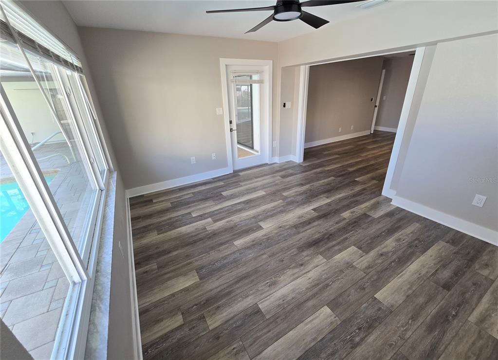 2940 Cypress Ridge Palm Harbor, FL 34684 - Photo 47 of 53 a view of an empty room with wooden floor and a window
