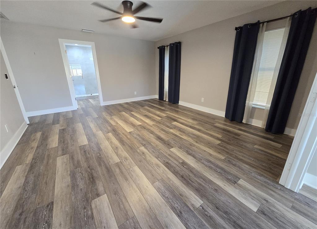2940 Cypress Ridge Palm Harbor, FL 34684 - Photo 48 of 53 wooden floor in an empty room with a window
