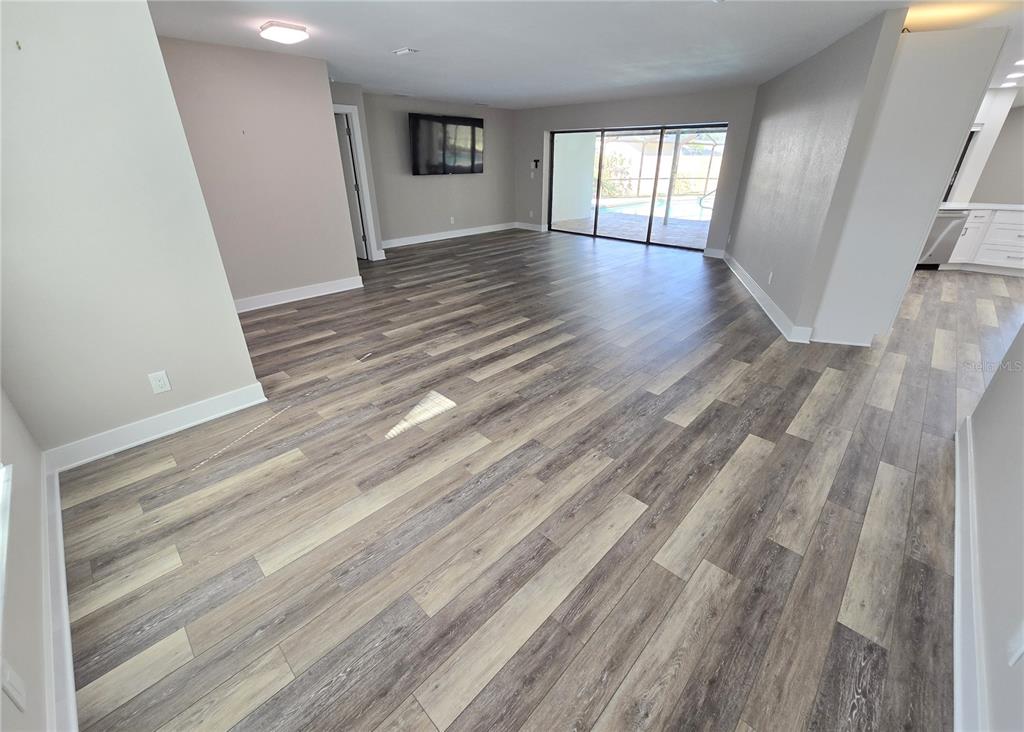 2940 Cypress Ridge Palm Harbor, FL 34684 - Photo 5 of 53 a view of empty room with wooden floor and fan