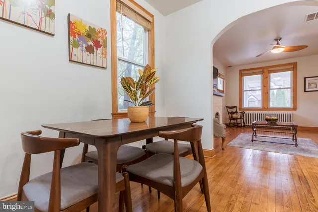 a view of a workspace with furniture and window