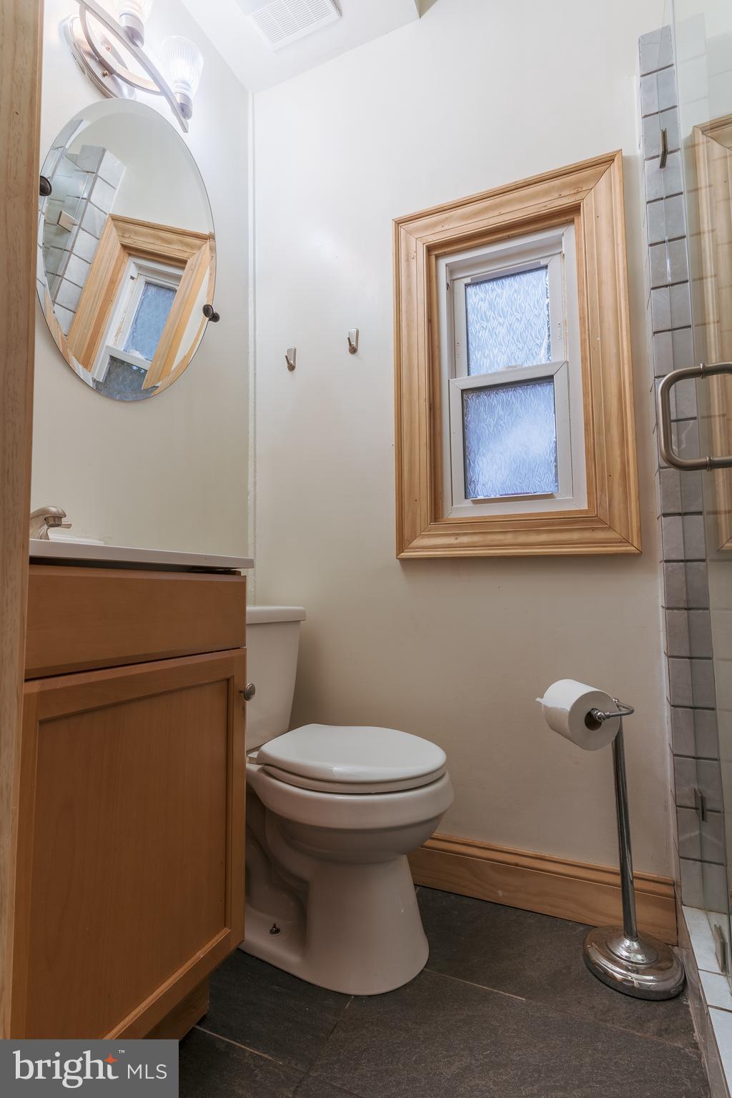 3817 22nd Street Northeast Washington, DC 20018 - Photo 15 of 37 a bathroom with a toilet and a mirror