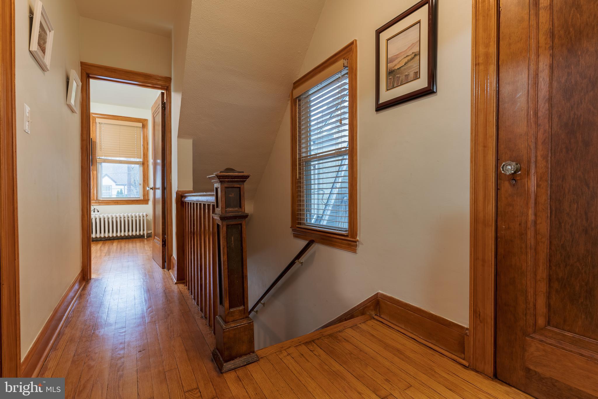 3817 22nd Street Northeast Washington, DC 20018 - Photo 17 of 37 a view of a hallway with wooden floor and stairs