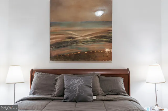 a living room with furniture and a lamp