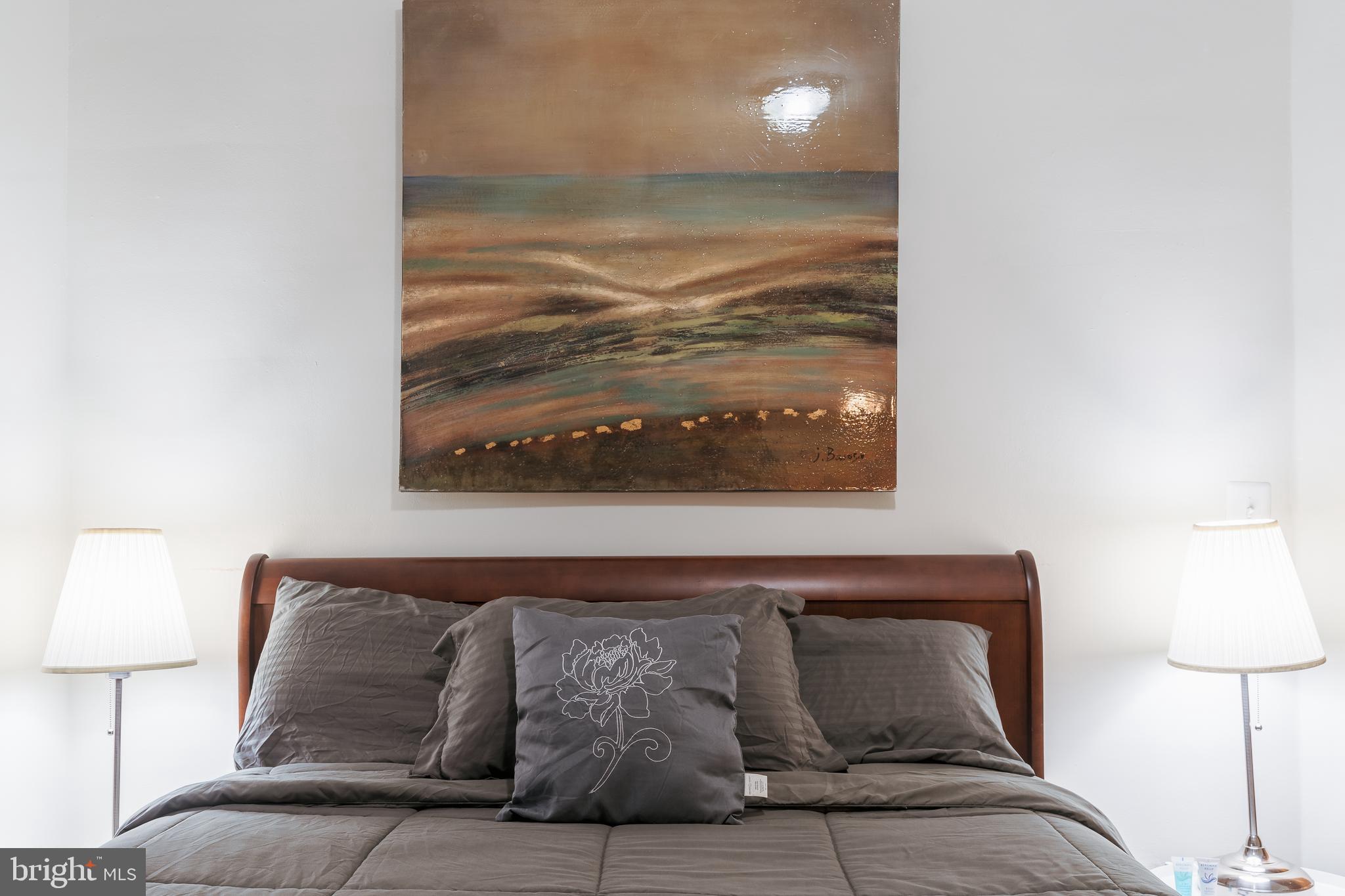 3817 22nd Street Northeast Washington, DC 20018 - Photo 20 of 37 a living room with furniture and a lamp