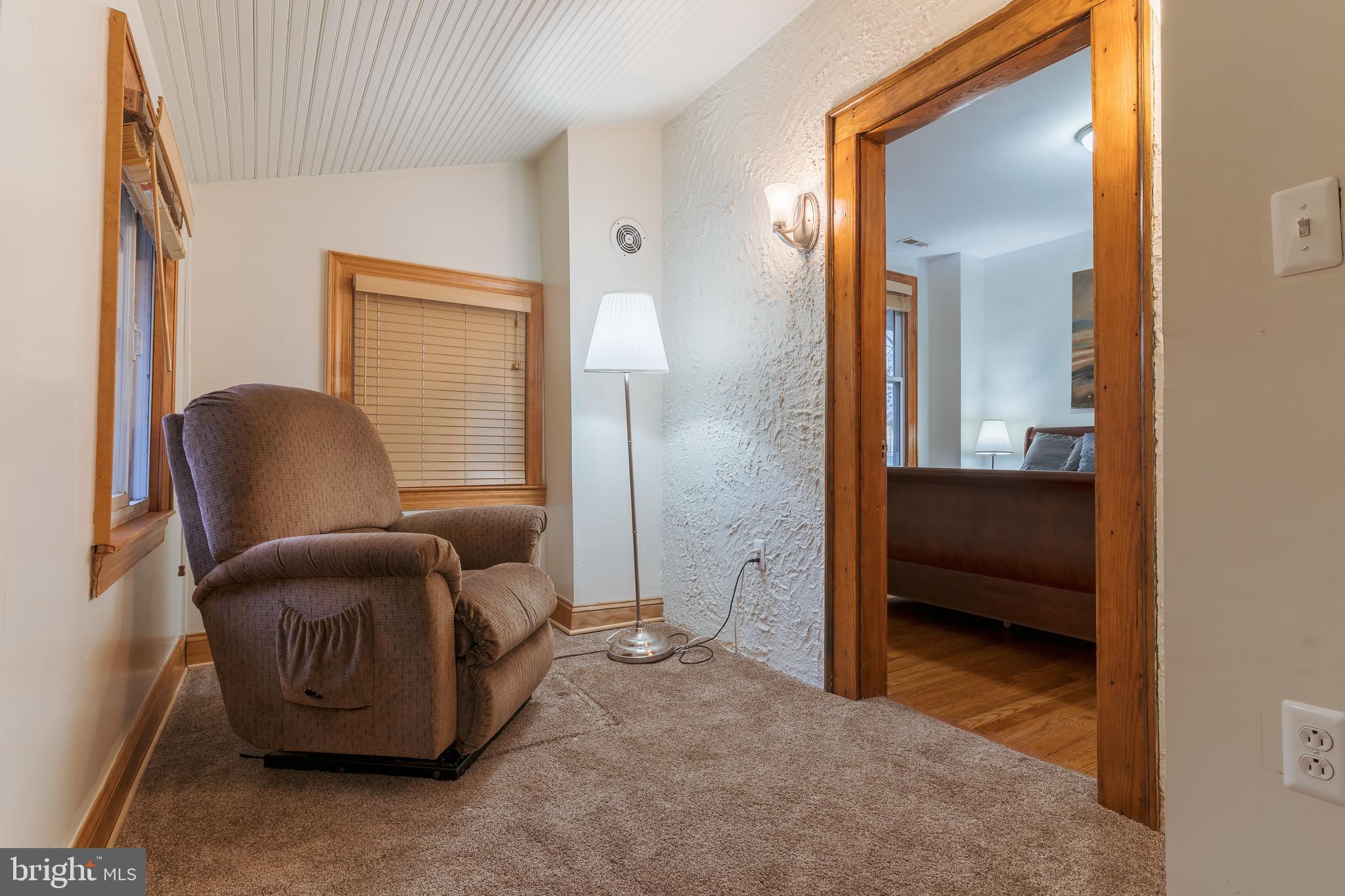3817 22nd Street Northeast Washington, DC 20018 - Photo 21 of 37 a living room with furniture and a chair