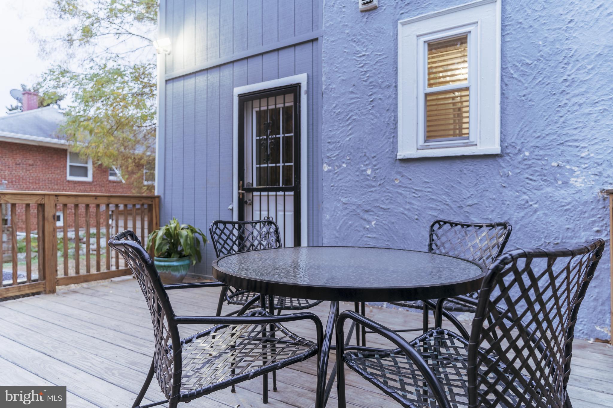 3817 22nd Street Northeast Washington, DC 20018 - Photo 33 of 37 a view of a wooden chairs and table in the patio