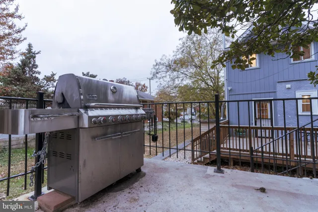 a view of a terrace with wooden fence and floor