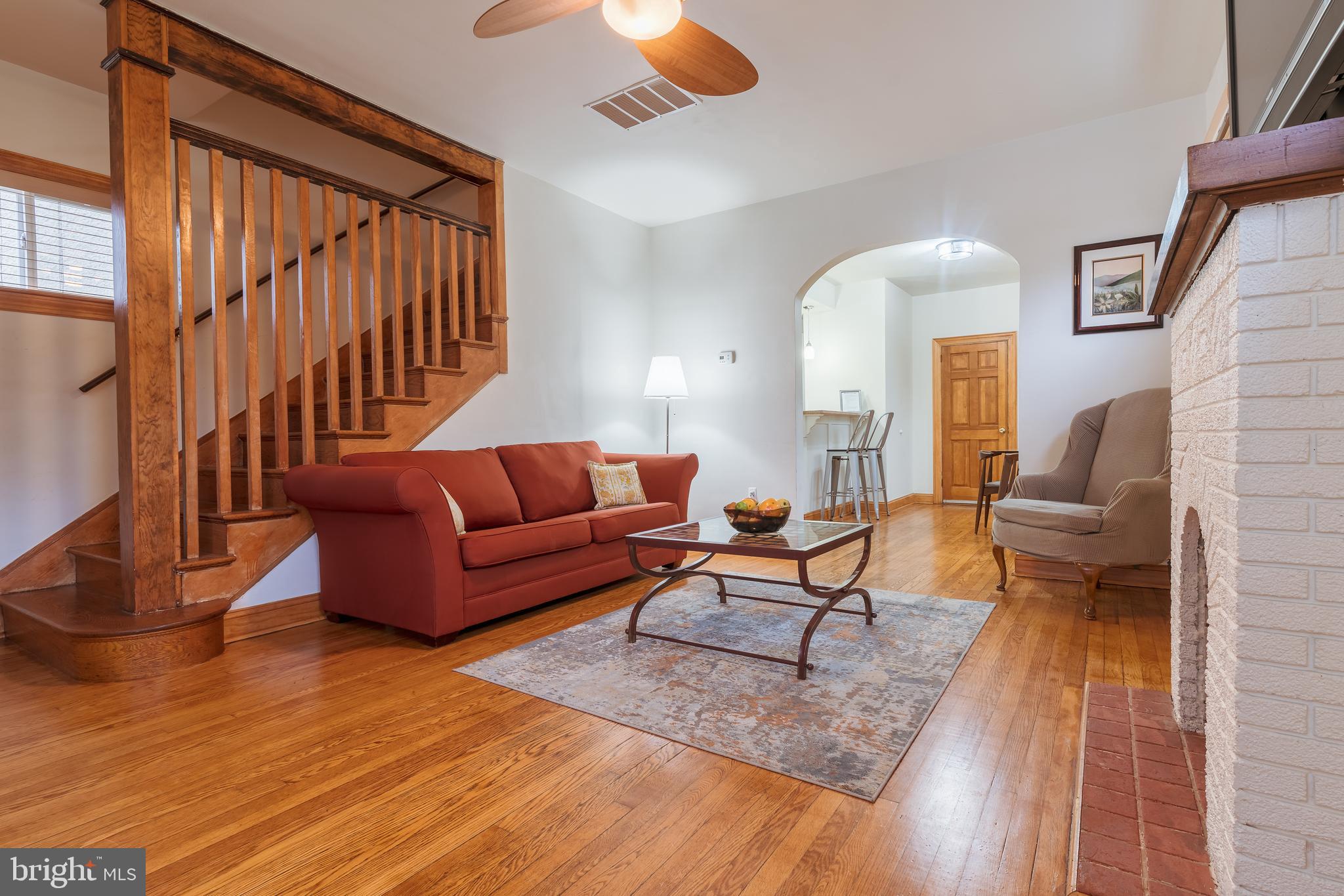 3817 22nd Street Northeast Washington, DC 20018 - Photo 4 of 37 a living room with furniture and a wooden floor