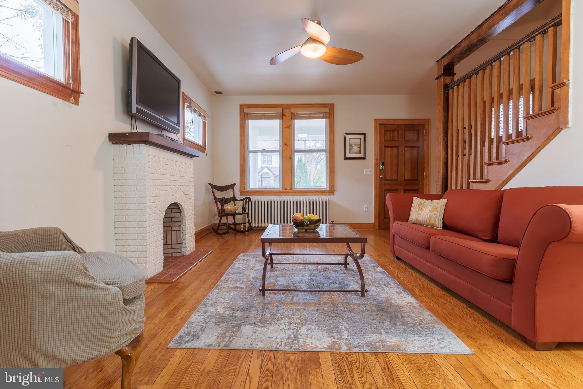 3817 22nd Street Northeast Washington, DC 20018 - Photo 5 of 37 a living room with furniture fireplace and flat screen tv