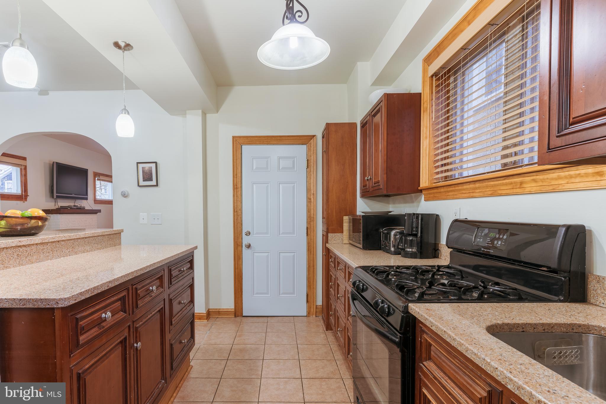 3817 22nd Street Northeast Washington, DC 20018 - Photo 10 of 37 a kitchen with a stove and a sink