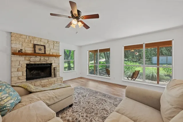 a living room with furniture and a fireplace