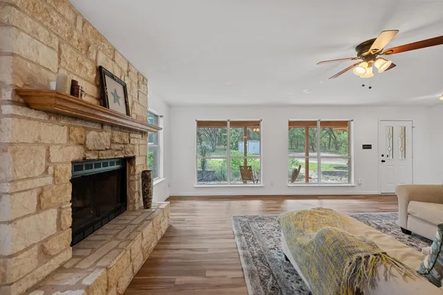 a living room with furniture and a fireplace