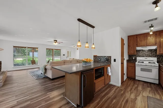 a kitchen with a stove and a sink