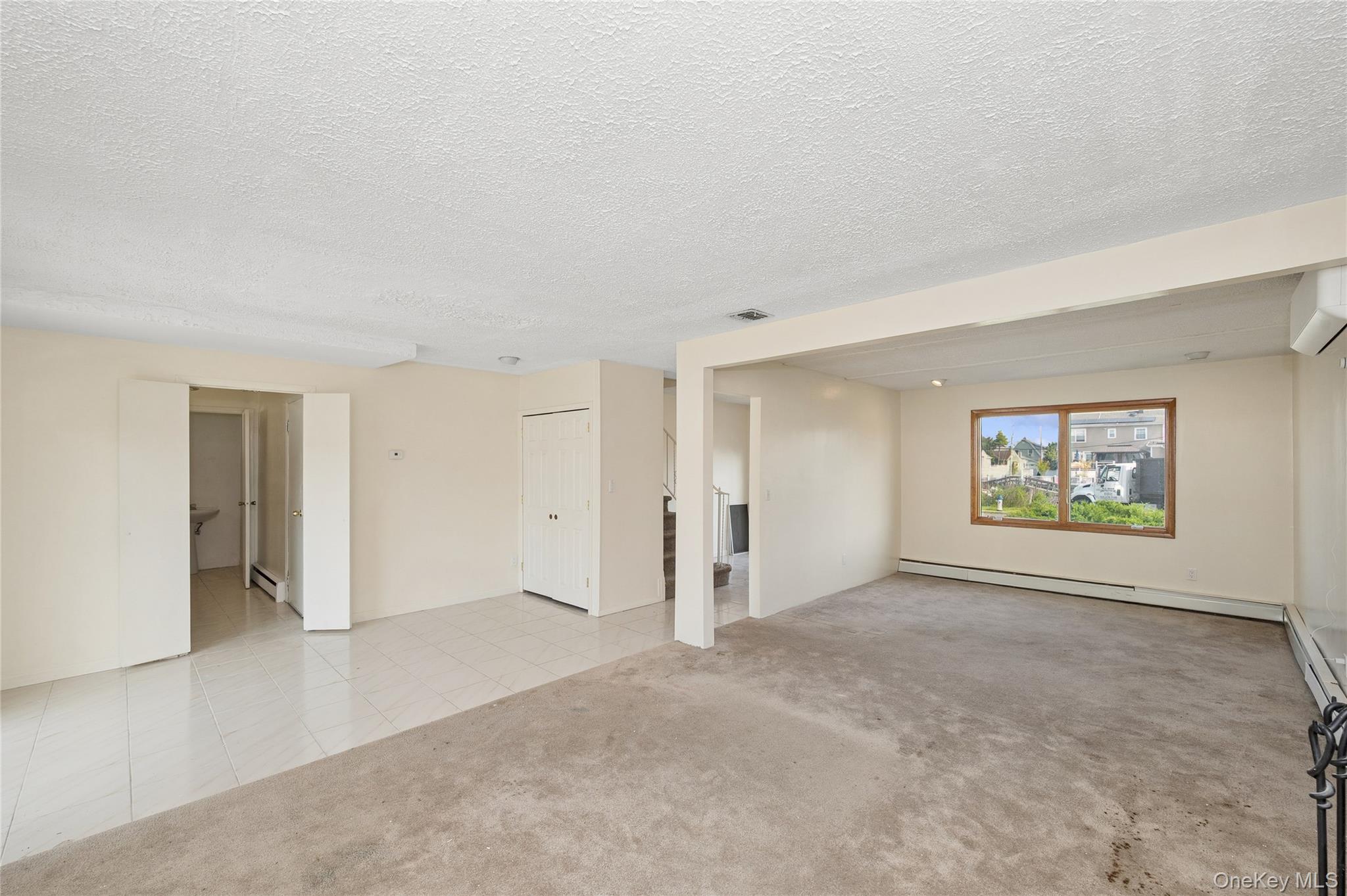 2625 Riverside Drive Wantagh, NY 11793 - Photo 6 of 20 an empty room with windows and closet