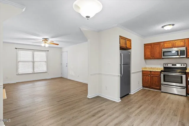 a view of kitchen with furniture and wooden floor