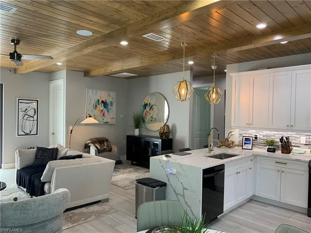 a living room with furniture and a clock
