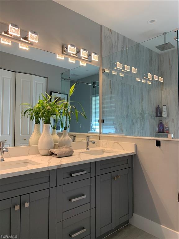 3651 29th Avenue Southwest Naples, FL 34117 - Photo 27 of 49 a bathroom with a sink double vanity and a mirror