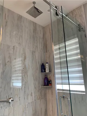 a view of entryway with wooden floor and stairs