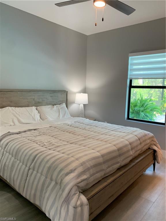 3651 29th Avenue Southwest Naples, FL 34117 - Photo 32 of 49 a bedroom with a bed and a window