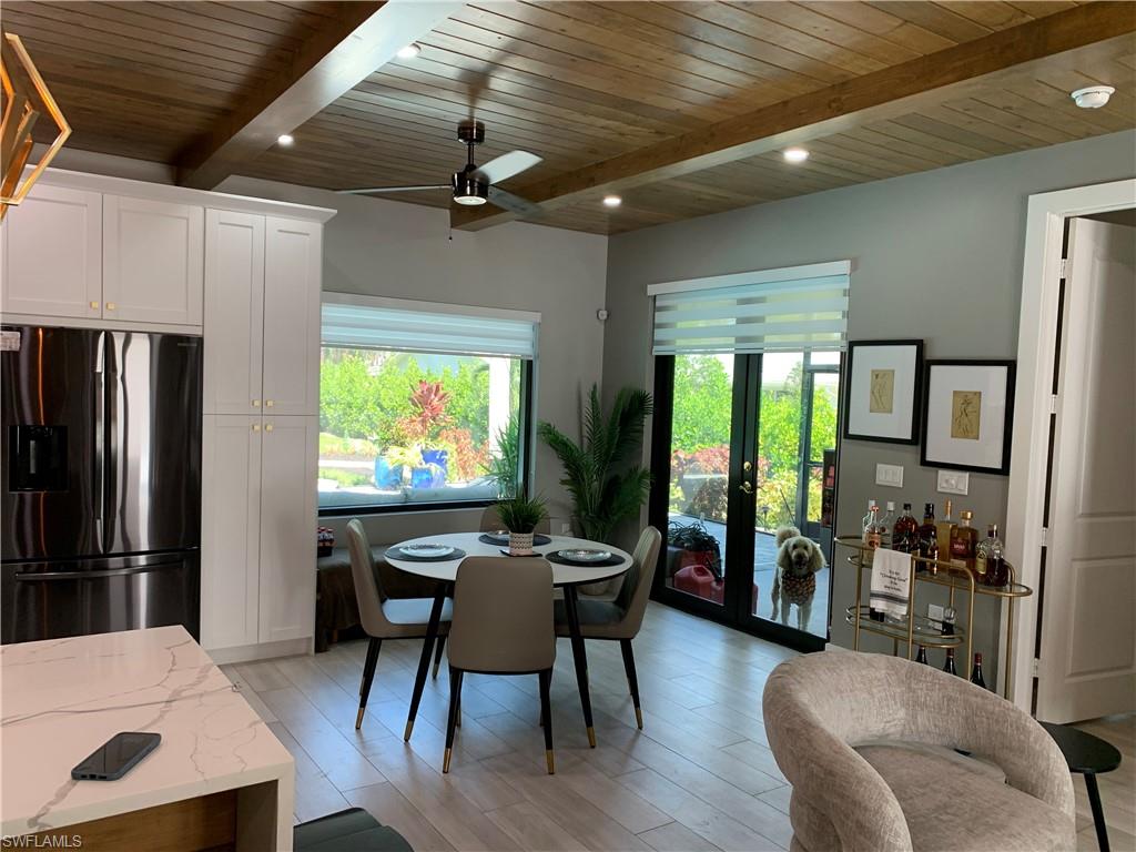 3651 29th Avenue Southwest Naples, FL 34117 - Photo 42 of 49 a view of a dining room with furniture window and outside view