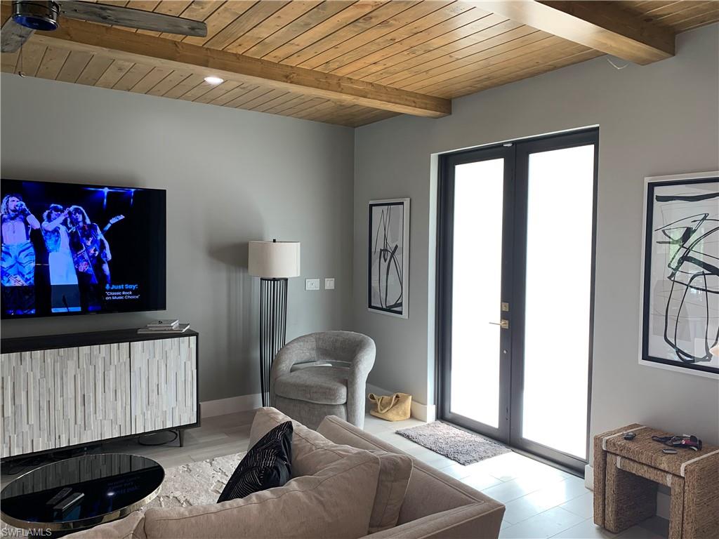 3651 29th Avenue Southwest Naples, FL 34117 - Photo 43 of 49 a living room with furniture and a window