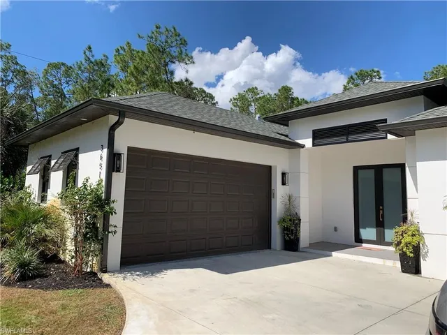 a front view of a house with a garage