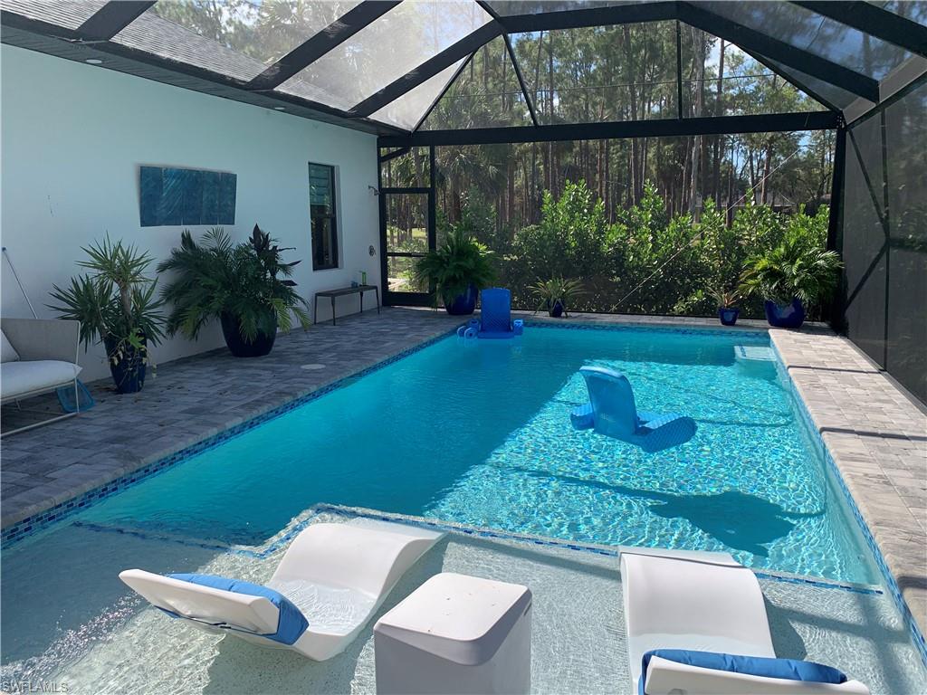 3651 29th Avenue Southwest Naples, FL 34117 - Photo 7 of 49 a backyard of a house with seating space