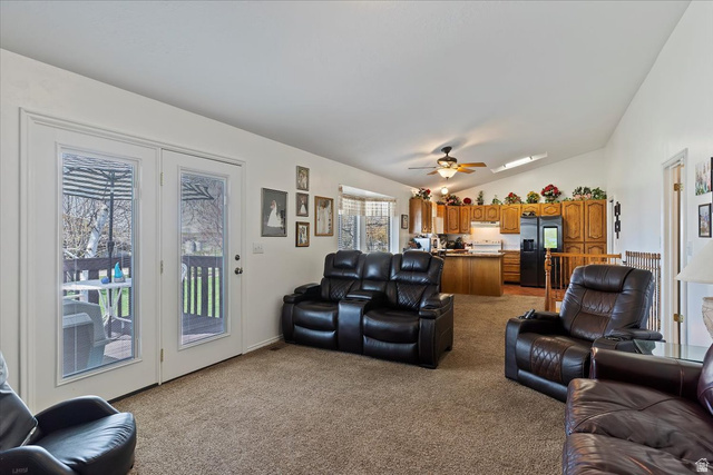 5321 South 3100th Street West Roy, UT 84067 - Photo 28 of 64 Living area with vaulted ceilings, recessed lighting, and a skylight