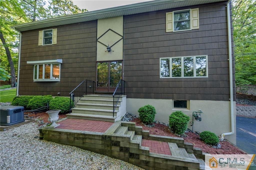 4 Tower Road Pompton Lakes, NJ 07442 - Photo 1 of 25 a front view of a house with a yard
