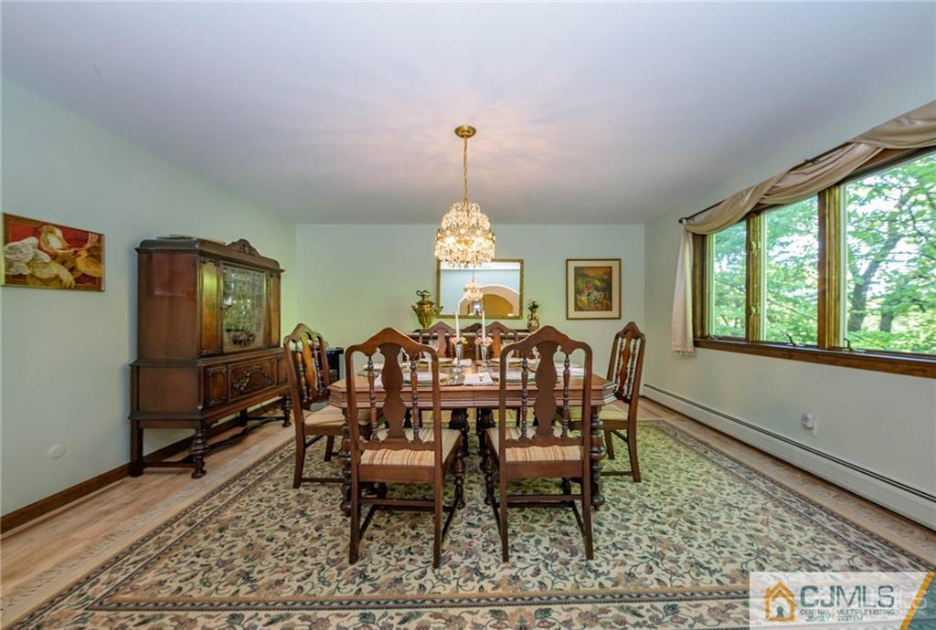 4 Tower Road Pompton Lakes, NJ 07442 - Photo 11 of 25 a view of a dining room with furniture window and wooden floor
