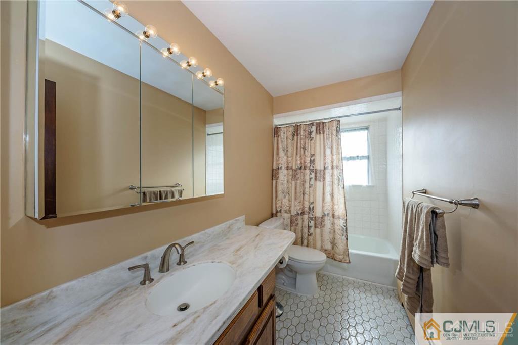 4 Tower Road Pompton Lakes, NJ 07442 - Photo 17 of 25 a bathroom with a sink a toilet and shower