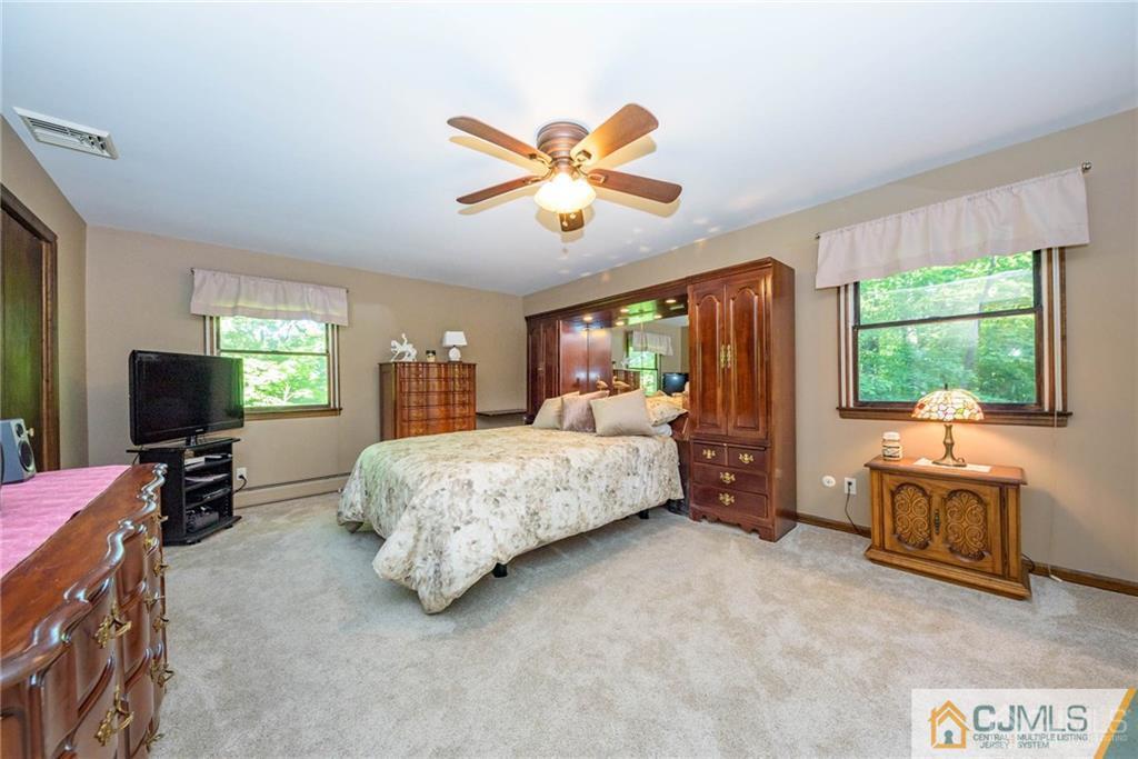 4 Tower Road Pompton Lakes, NJ 07442 - Photo 18 of 25 a bedroom with a bed and furniture