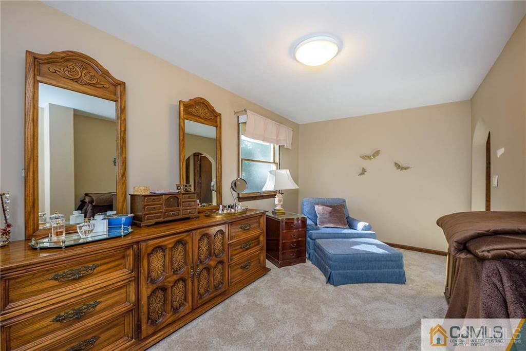 4 Tower Road Pompton Lakes, NJ 07442 - Photo 20 of 25 a bathroom with double vanity and a mirror