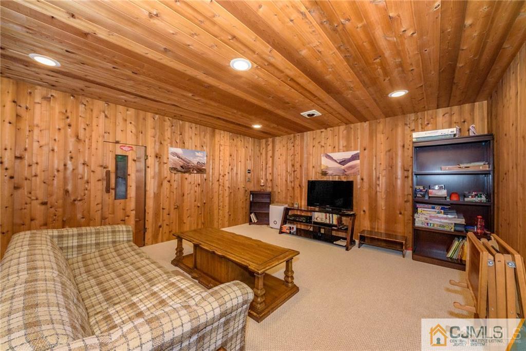 4 Tower Road Pompton Lakes, NJ 07442 - Photo 22 of 25 a bedroom with furniture and a flat screen tv