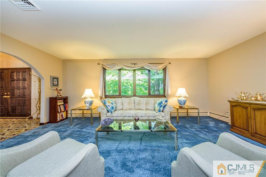 4 Tower Road Pompton Lakes, NJ 07442 - Photo 4 of 25 a living room with furniture and a fireplace