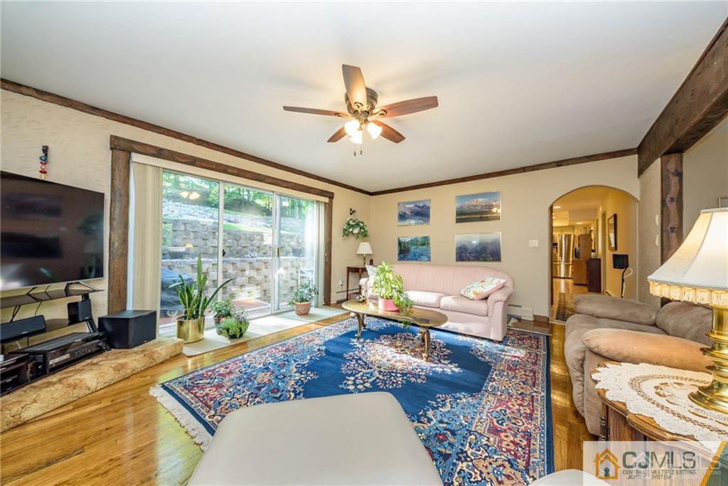 4 Tower Road Pompton Lakes, NJ 07442 - Photo 6 of 25 a living room with furniture and a flat screen tv