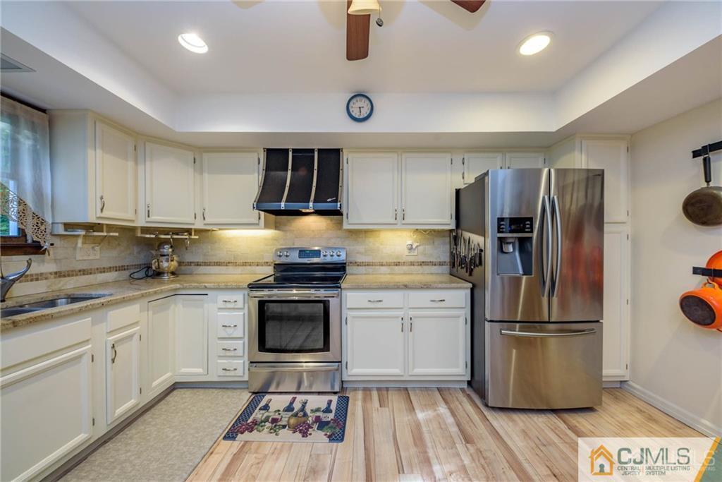 4 Tower Road Pompton Lakes, NJ 07442 - Photo 7 of 25 a kitchen with a refrigerator sink and stove