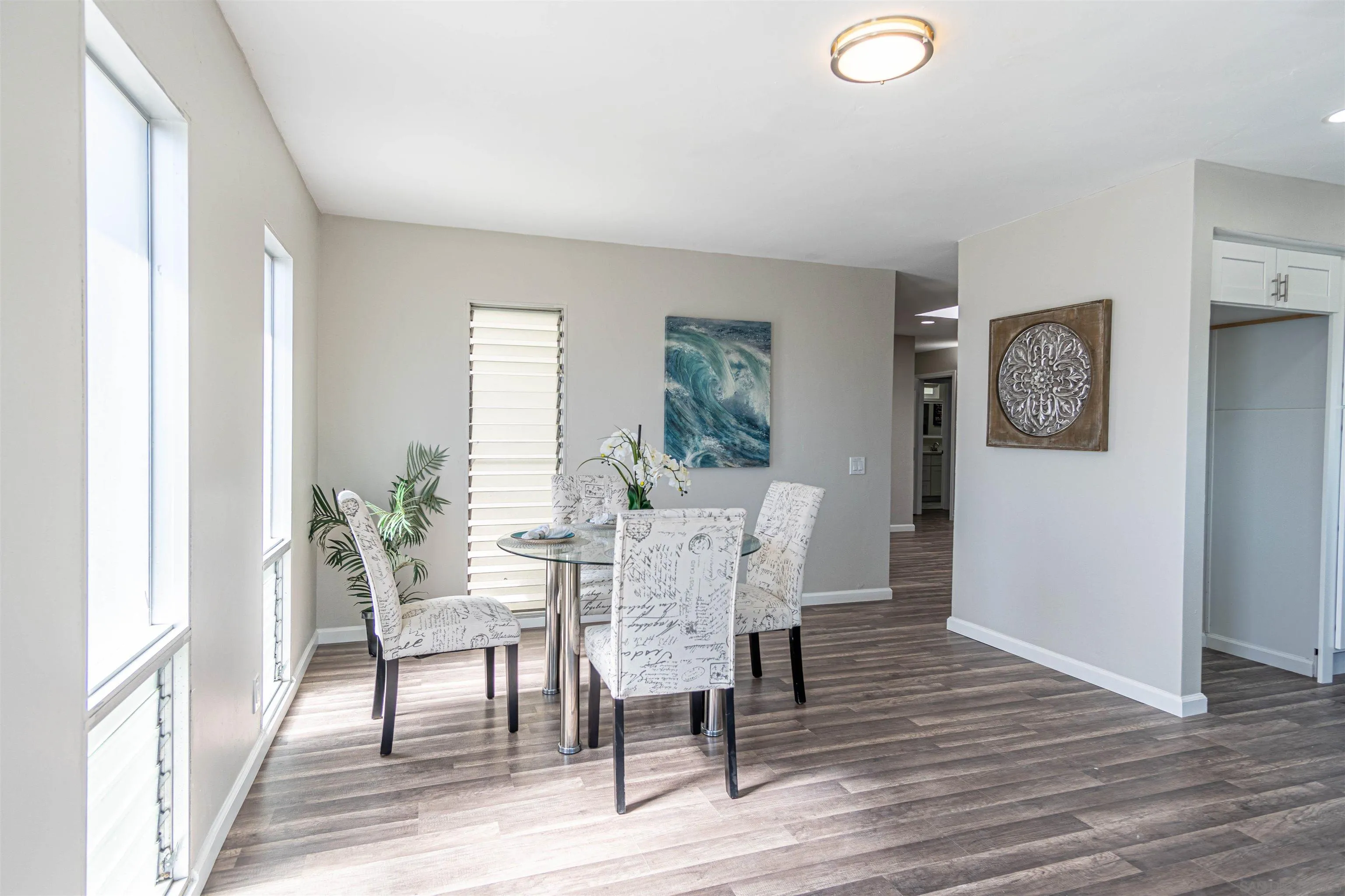 3747 Vista Campana South, Unit 43 Oceanside, CA 92057 - Photo 11 of 30 a view of a dining room with furniture window and wooden floor