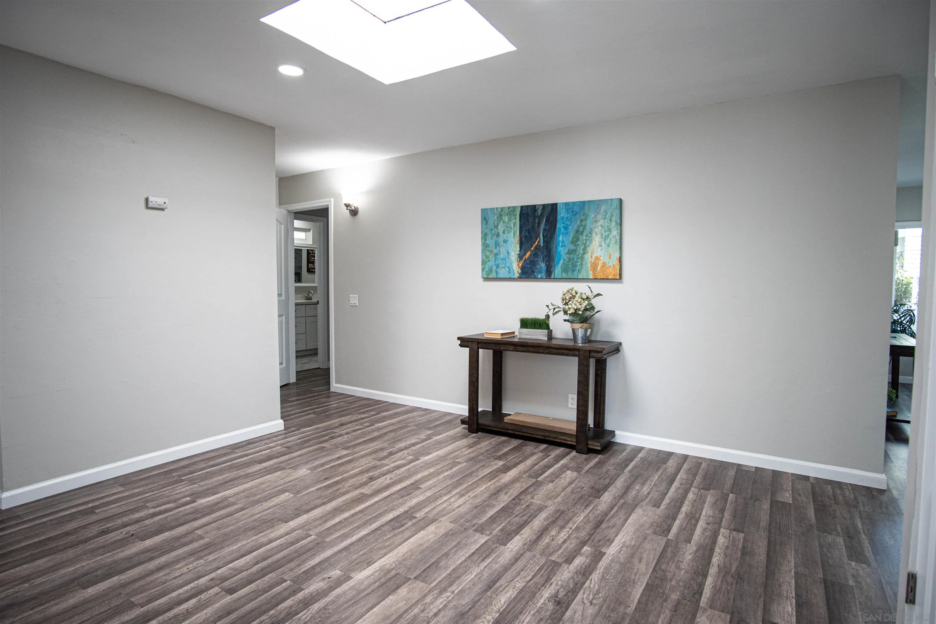3747 Vista Campana South, Unit 43 Oceanside, CA 92057 - Photo 12 of 30 a view of a room with wooden floor furniture and windows