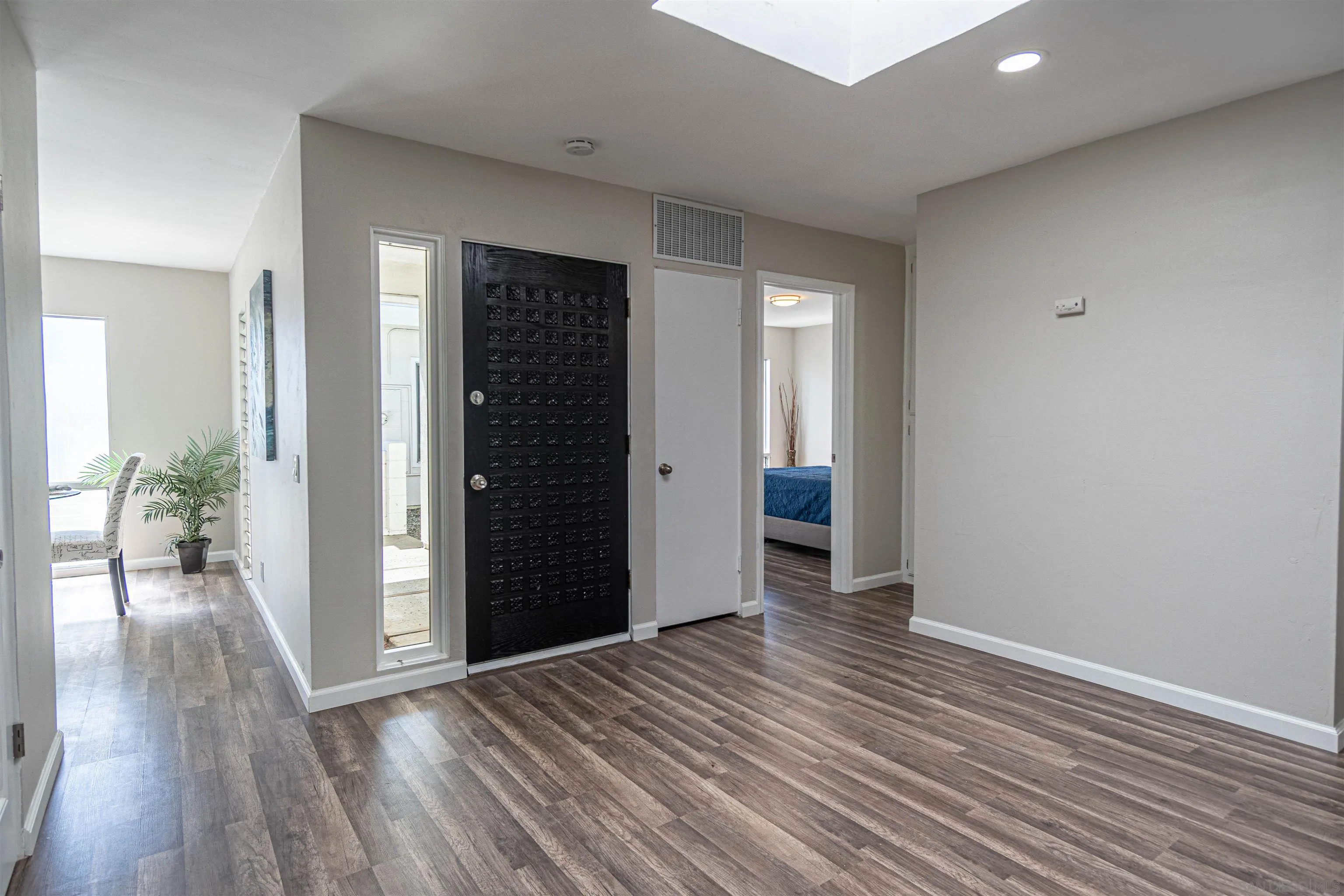 3747 Vista Campana South, Unit 43 Oceanside, CA 92057 - Photo 13 of 30 wooden floor in an empty room and a window