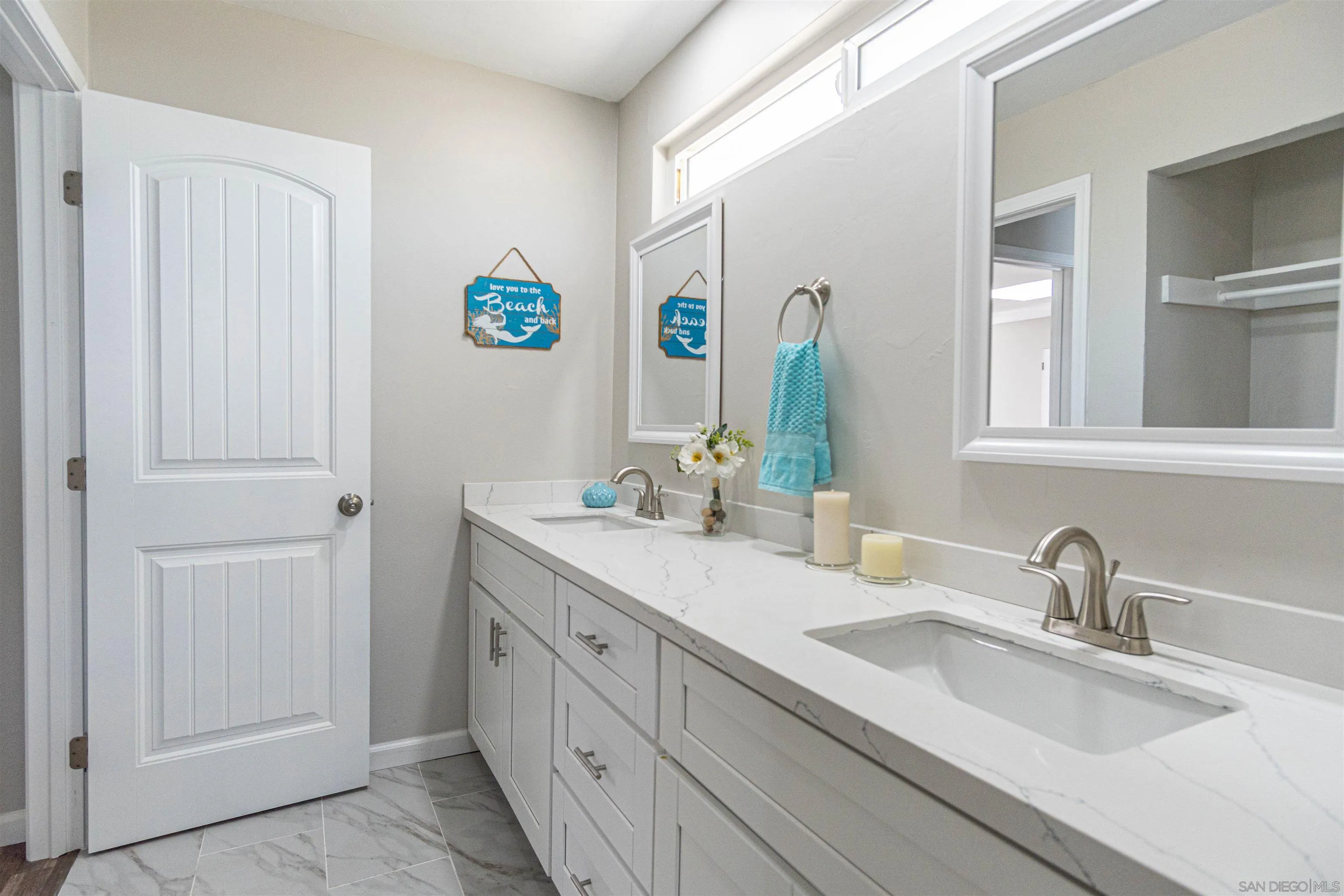 3747 Vista Campana South, Unit 43 Oceanside, CA 92057 - Photo 21 of 30 a bathroom with a sink a vanity and a mirror