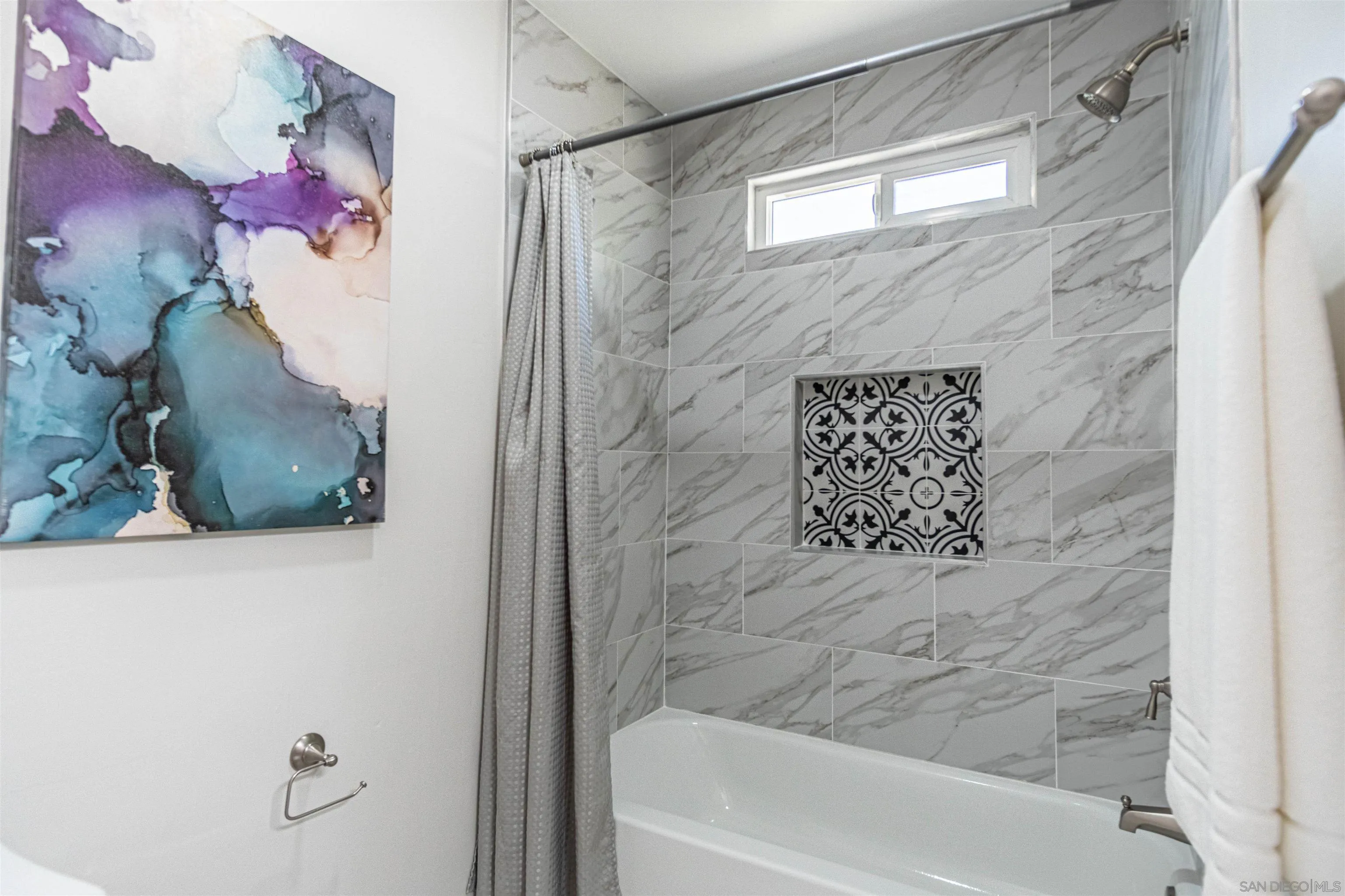 3747 Vista Campana South, Unit 43 Oceanside, CA 92057 - Photo 24 of 30 a bathroom with a bathtub and shower