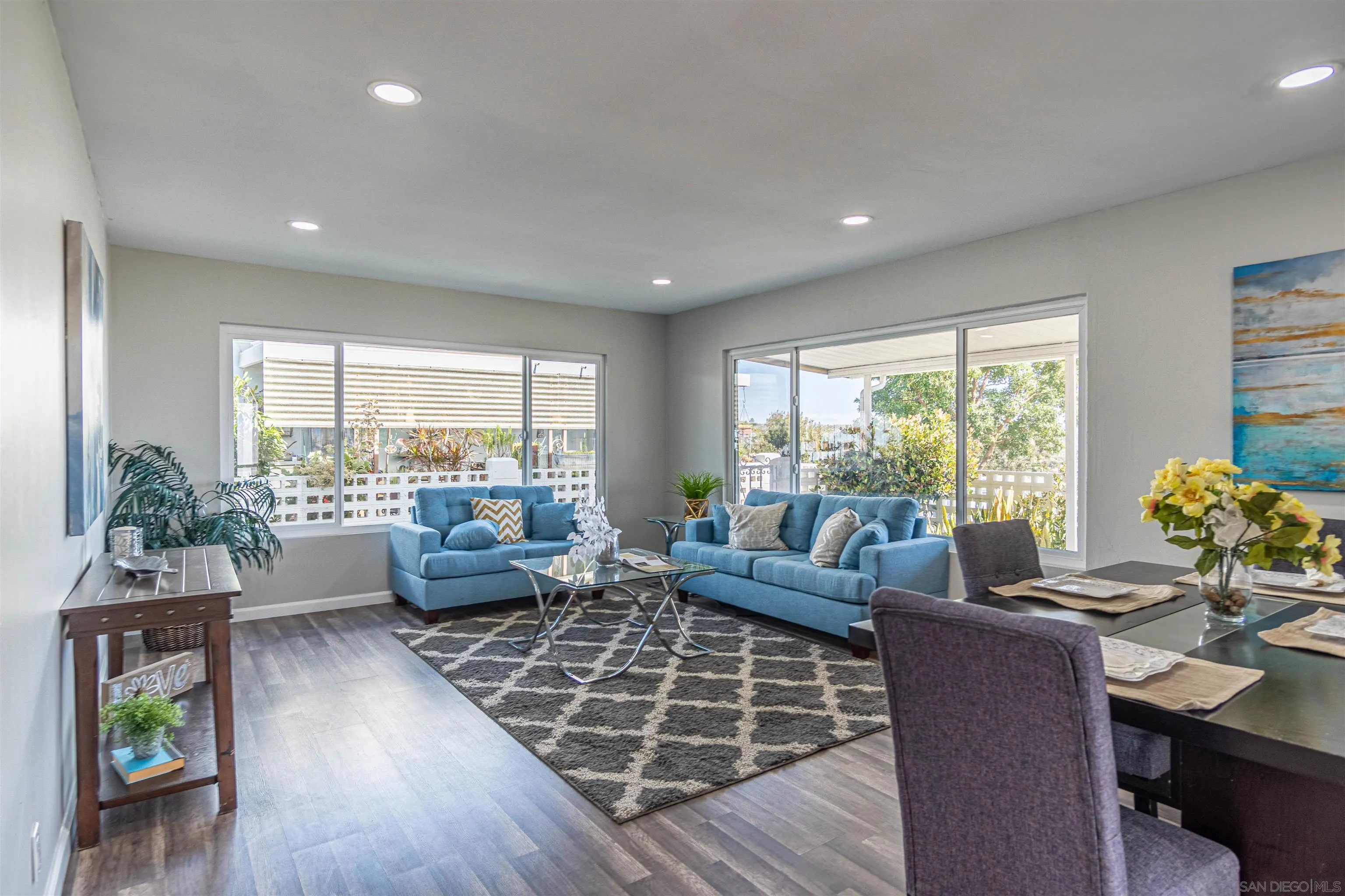 3747 Vista Campana South, Unit 43 Oceanside, CA 92057 - Photo 3 of 30 a living room with furniture and a large window
