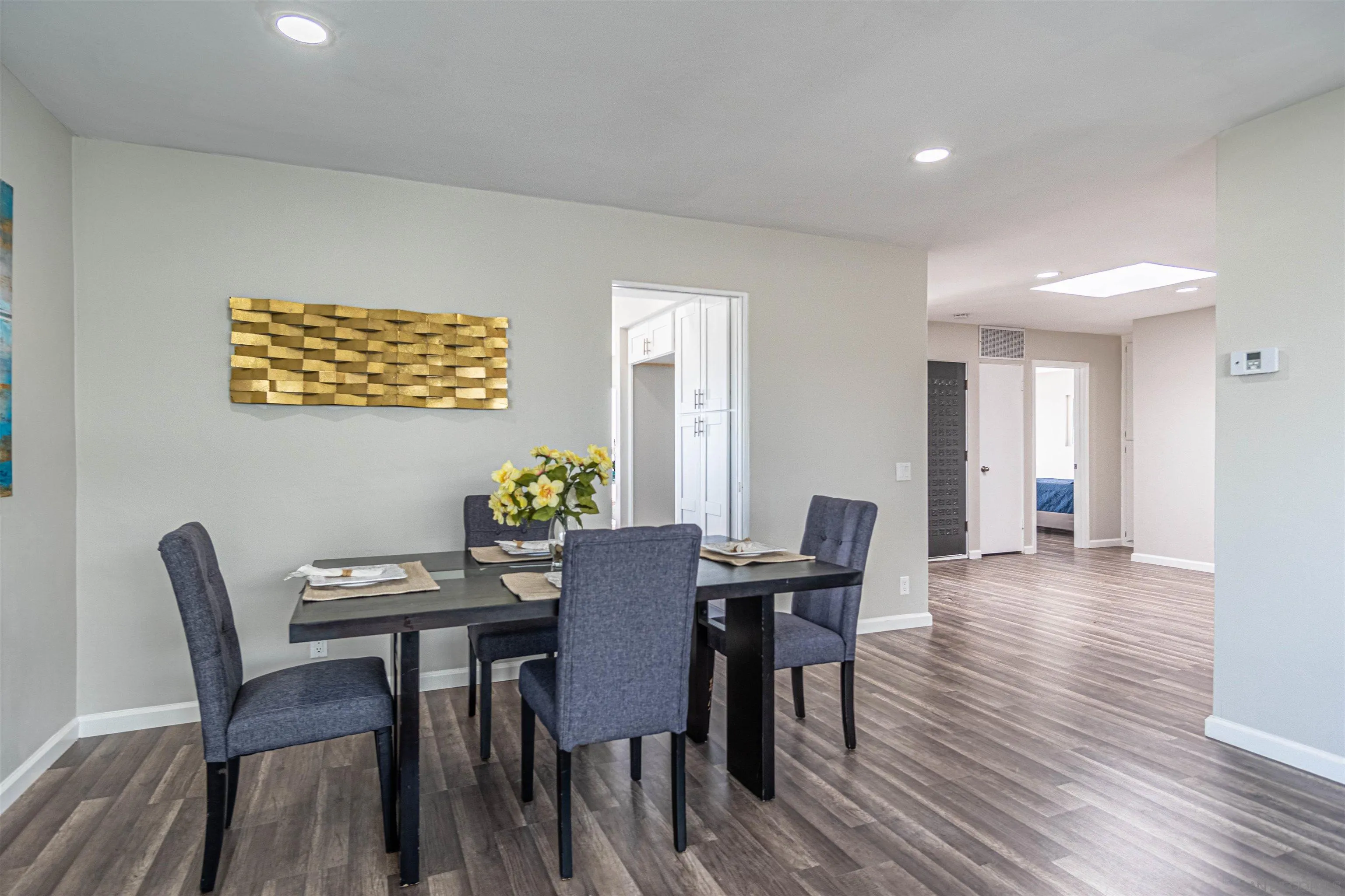 3747 Vista Campana South, Unit 43 Oceanside, CA 92057 - Photo 4 of 30 a view of a dining room with furniture and wooden floor