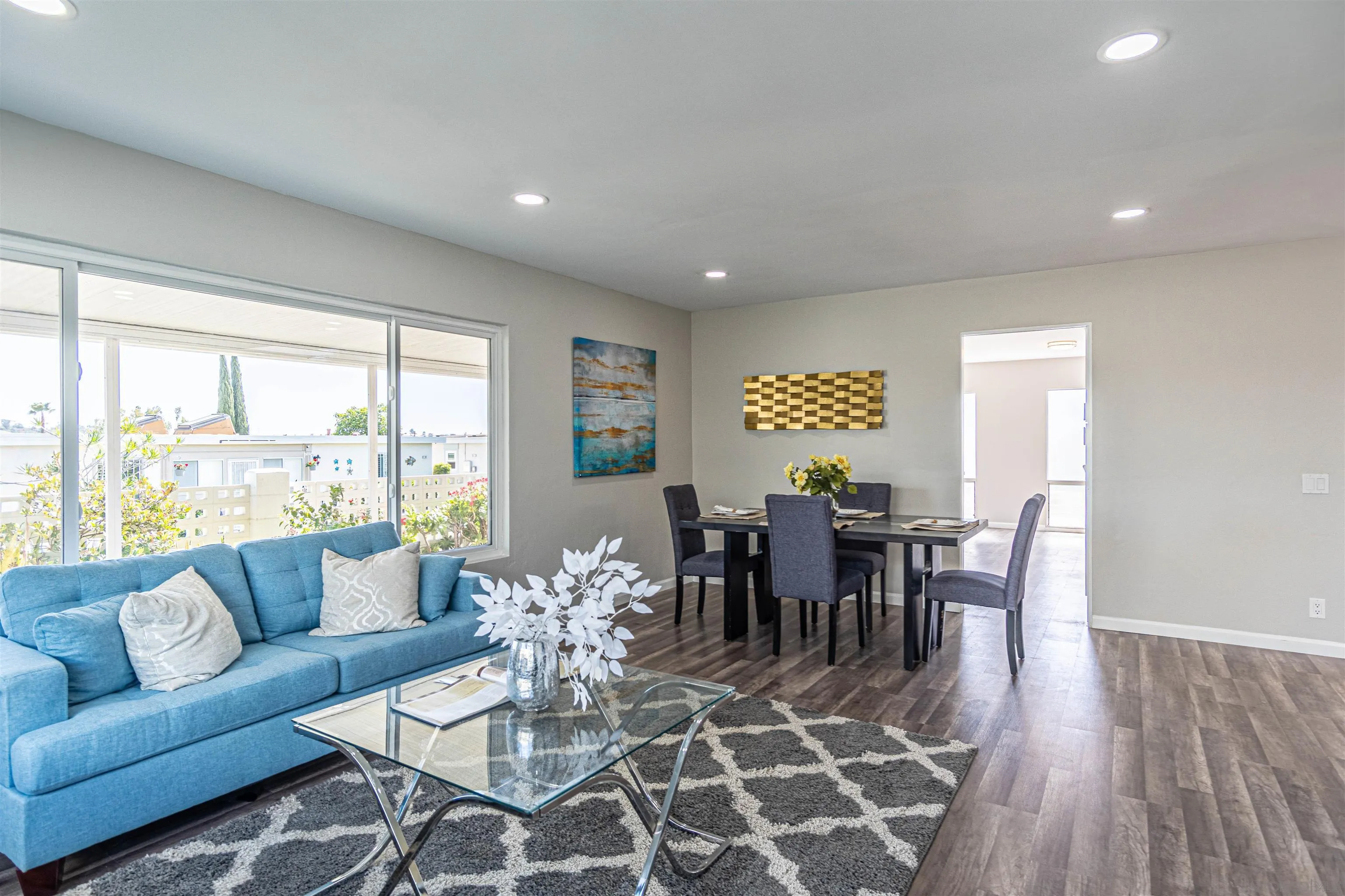 3747 Vista Campana South, Unit 43 Oceanside, CA 92057 - Photo 6 of 30 a view of a dining room with furniture window and wooden floor