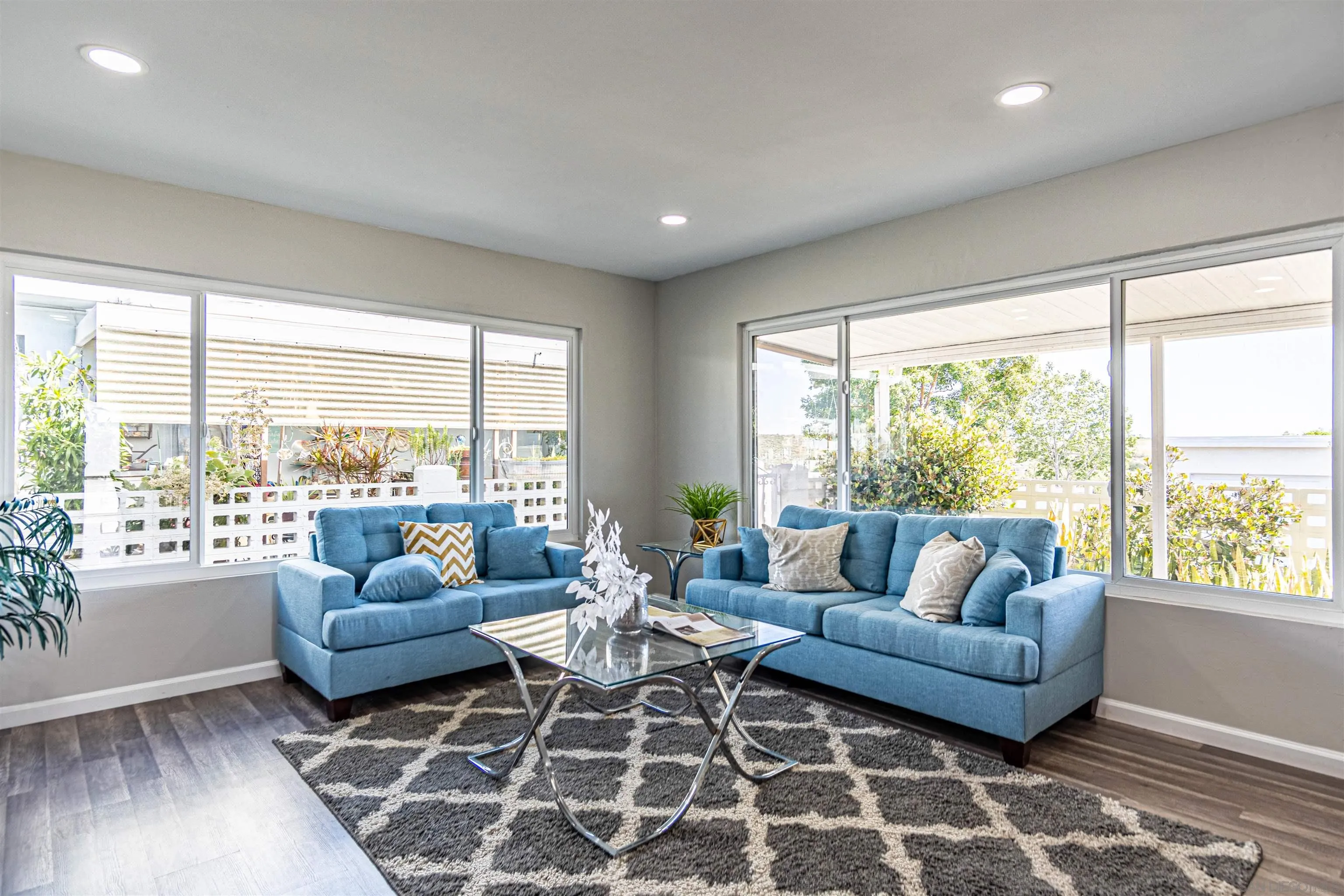3747 Vista Campana South, Unit 43 Oceanside, CA 92057 - Photo 7 of 30 a living room with furniture and a large window