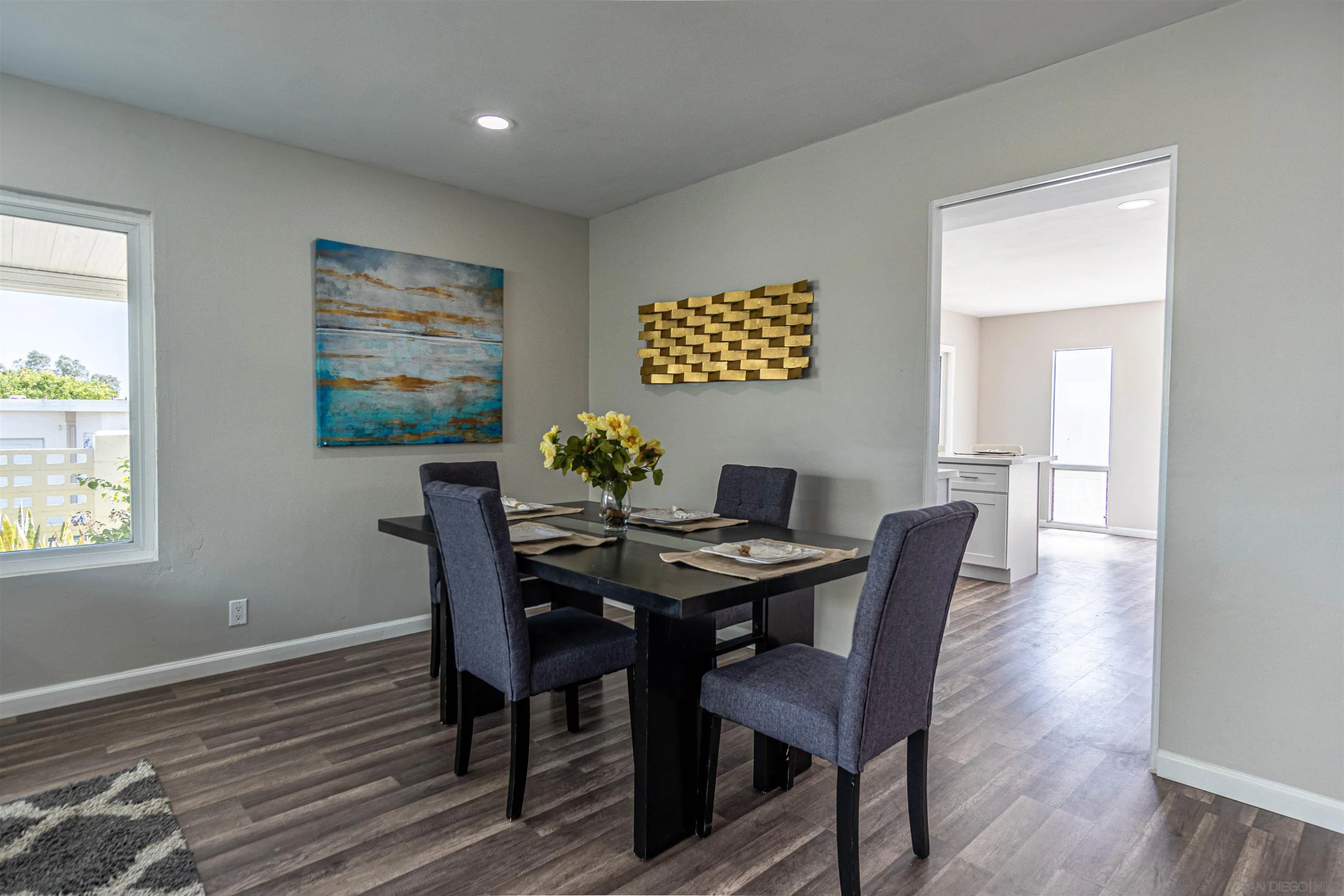 3747 Vista Campana South, Unit 43 Oceanside, CA 92057 - Photo 8 of 30 a view of a dining room with furniture and wooden floor