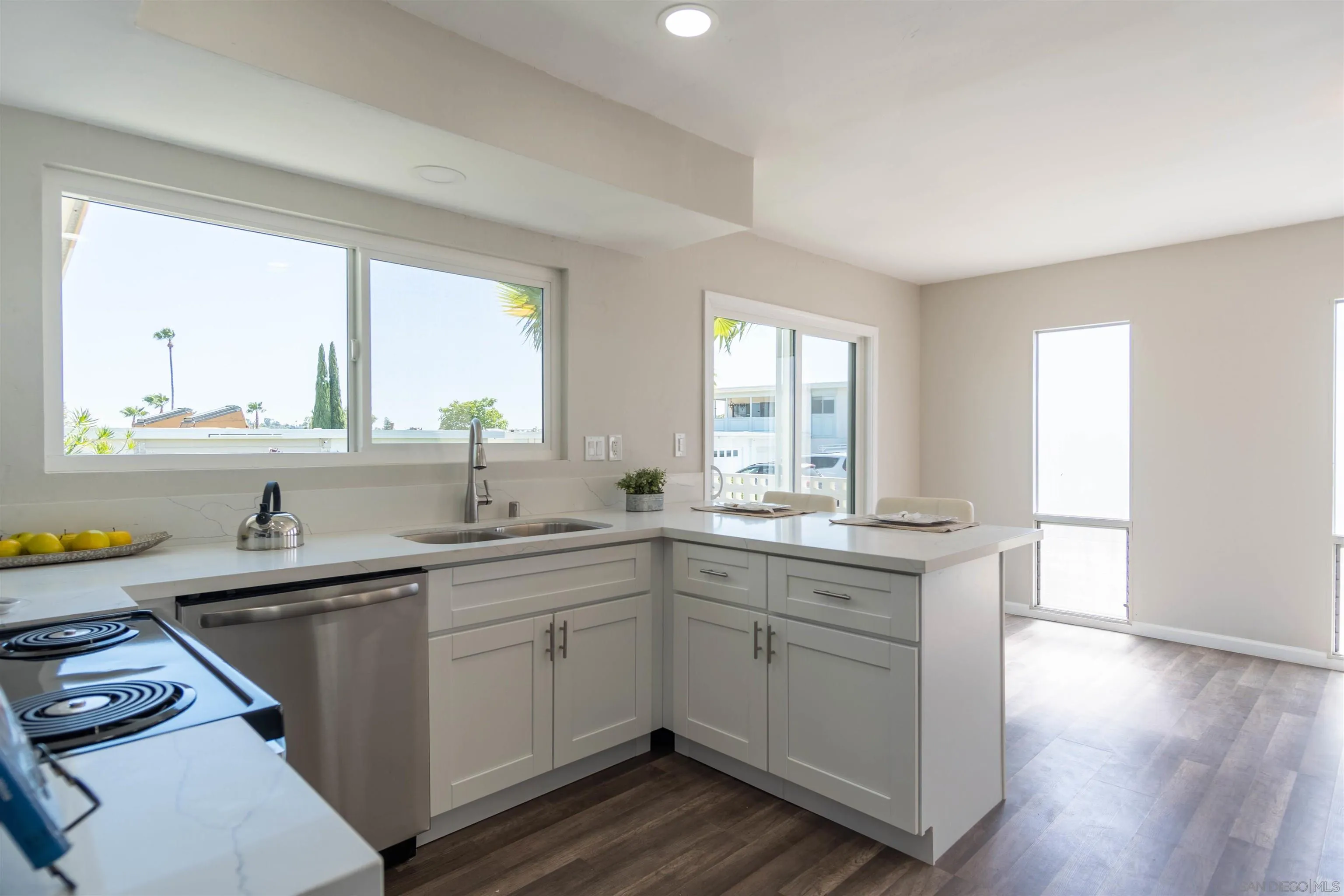3747 Vista Campana South, Unit 43 Oceanside, CA 92057 - Photo 9 of 30 a kitchen with a sink stove and cabinets